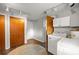 Bright laundry room with a door to the backyard and appliances at 705 Washington Ave, Eustis, FL 32726