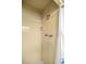 Tiled shower area featuring a shower head and shampoo/soap alcove at 705 Washington Ave, Eustis, FL 32726