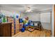 Bonus room with wood floors offers plenty of storage with large windows for natural light at 705 Washington Ave, Eustis, FL 32726