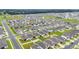 Wide aerial view showcasing a dense residential neighborhood layout with tree-lined streets at 7224 Sw 61St Pl, Ocala, FL 34474