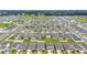 High aerial shot of a neighborhood showcasing the rooftops and a park in the distance at 7224 Sw 61St Pl, Ocala, FL 34474
