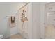 Bathroom view showing shower curtain with floral design and light tile flooring at 7224 Sw 61St Pl, Ocala, FL 34474
