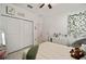 Bedroom with view of closet and doorway and ivy decor on the wall at 7224 Sw 61St Pl, Ocala, FL 34474