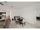 Light and airy dining room with neutral tones and seating for four at 7224 Sw 61St Pl, Ocala, FL 34474