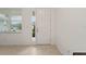 Bright entryway showcasing tile flooring, a window for natural light, and a clear view of the front door at 7224 Sw 61St Pl, Ocala, FL 34474