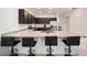 Large kitchen island with bar stool seating and granite countertops at 7224 Sw 61St Pl, Ocala, FL 34474