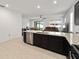 Open floor plan kitchen with stainless steel appliances and granite countertops at 7224 Sw 61St Pl, Ocala, FL 34474