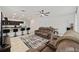 Open living space with a dining area, kitchen with island, and comfortable seating at 7224 Sw 61St Pl, Ocala, FL 34474