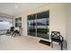 Patio area with seating and sliding doors leading to the home's interior at 7224 Sw 61St Pl, Ocala, FL 34474