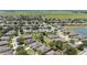 Wide aerial shot of a planned community boasting lush landscaping, mature trees, and a peaceful lake at 7333 Sw 98Th Ct, Ocala, FL 34481