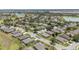 Aerial shot captures a well-designed community with lush landscaping, mature trees and neighborhood lakes and golf course at 7333 Sw 98Th Ct, Ocala, FL 34481