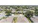 Aerial view showcases home with a well-manicured lawn and landscaping plus mature trees and shrubs at 7333 Sw 98Th Ct, Ocala, FL 34481
