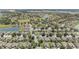 Extensive aerial view of a sprawling residential community with manicured lawns, lakes, and mature trees at 7333 Sw 98Th Ct, Ocala, FL 34481