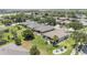An elevated view of a residential community featuring well-kept homes, green lawns, and mature trees at 7333 Sw 98Th Ct, Ocala, FL 34481