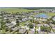 An attractive residential neighborhood featuring mature landscaping, community ponds and green spaces in an aerial view at 7333 Sw 98Th Ct, Ocala, FL 34481
