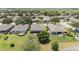 Aerial view of a suburban neighborhood showcasing orderly homes, well-maintained yards, and mature trees at 7333 Sw 98Th Ct, Ocala, FL 34481