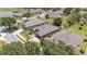 Home boasts meticulously kept landscaping including mature trees, as well as a spacious driveway and two-car garage at 7333 Sw 98Th Ct, Ocala, FL 34481