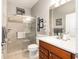 Stylish bathroom featuring a glass-enclosed shower, a dark wood vanity, and contemporary decor at 7333 Sw 98Th Ct, Ocala, FL 34481