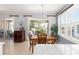 Charming dining area bathed in natural light with views of the screened lanai at 7333 Sw 98Th Ct, Ocala, FL 34481