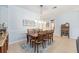 Elegant dining room featuring a wooden table set and decorative lighting fixture at 7333 Sw 98Th Ct, Ocala, FL 34481