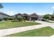 Charming single-story home featuring a neatly landscaped front yard and a two-car garage at 7333 Sw 98Th Ct, Ocala, FL 34481