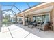 Expansive screened-in lanai featuring multiple seating areas, perfect for entertaining and enjoying the outdoors year-round at 7333 Sw 98Th Ct, Ocala, FL 34481