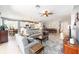 Spacious living area with a view of the kitchen, dining room and comfortable seating at 7333 Sw 98Th Ct, Ocala, FL 34481