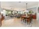 Expansive open-concept living and dining area with tile flooring and neutral decor at 7333 Sw 98Th Ct, Ocala, FL 34481