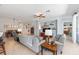 Open living space featuring tile flooring, comfortable seating, and dining area views at 7333 Sw 98Th Ct, Ocala, FL 34481