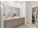 Bright bathroom featuring double sink vanity and neutral color scheme at 7571 Sw 64Th Street Rd, Ocala, FL 34474