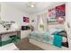 Charming bedroom with colorful décor, including posters and a Puerto Rican flag at 7571 Sw 64Th Street Rd, Ocala, FL 34474