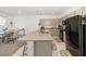 Spacious kitchen featuring an island with counter seating and sleek appliances at 7571 Sw 64Th Street Rd, Ocala, FL 34474