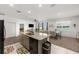Open-concept kitchen and dining area with stainless steel appliances and view of the dining room at 7571 Sw 64Th Street Rd, Ocala, FL 34474