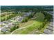 A neighborhood bordering a golf course offers scenic views in an aerial shot at 96 Hickory Crse, Ocala, FL 34472