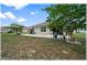 A spacious backyard features a well-maintained lawn and a patio area at 96 Hickory Crse, Ocala, FL 34472