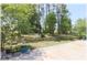 Large backyard with mature trees and a well maintained lawn at 96 Hickory Crse, Ocala, FL 34472