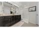 Bathroom featuring double vanity, granite countertop, and shower at 96 Hickory Crse, Ocala, FL 34472