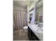 Bathroom features a shower/tub combo, large mirror, and modern vanity at 96 Hickory Crse, Ocala, FL 34472