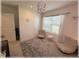 Bedroom features a modern light fixture, large windows and carpet floors at 96 Hickory Crse, Ocala, FL 34472