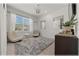 Bright bedroom featuring neutral decor, a large window, and a serene ambiance at 96 Hickory Crse, Ocala, FL 34472