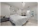 Bright bedroom with chandelier lighting, a plush rug, and connecting ensuite bathroom at 96 Hickory Crse, Ocala, FL 34472