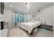 Bright bedroom with a plush rug, elegant chandelier, and a serene ambiance at 96 Hickory Crse, Ocala, FL 34472