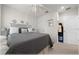 Bright bedroom features a queen-sized bed with decorative pillows, and neutral-toned decor at 96 Hickory Crse, Ocala, FL 34472