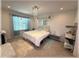 Cozy bedroom featuring a comfortable bed, soft lighting, and stylish decor at 96 Hickory Crse, Ocala, FL 34472