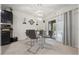 A dining area featuring modern lighting, a glass table, and stylish seating with walkout access at 96 Hickory Crse, Ocala, FL 34472