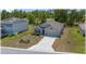 Single-story home with manicured landscaping, shuttered windows, and attached garage at 96 Hickory Crse, Ocala, FL 34472