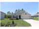 Charming single Gathering home with a well-maintained front yard and two car garage at 96 Hickory Crse, Ocala, FL 34472
