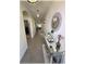 Well-lit hallway featuring decorative accents, leading to the living areas of the home at 96 Hickory Crse, Ocala, FL 34472