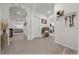 Bright hallway showcasing modern decor, tile flooring, and an open layout leading to other living areas at 96 Hickory Crse, Ocala, FL 34472