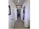 Hallway view of walk-in closet, and half-bath at 96 Hickory Crse, Ocala, FL 34472